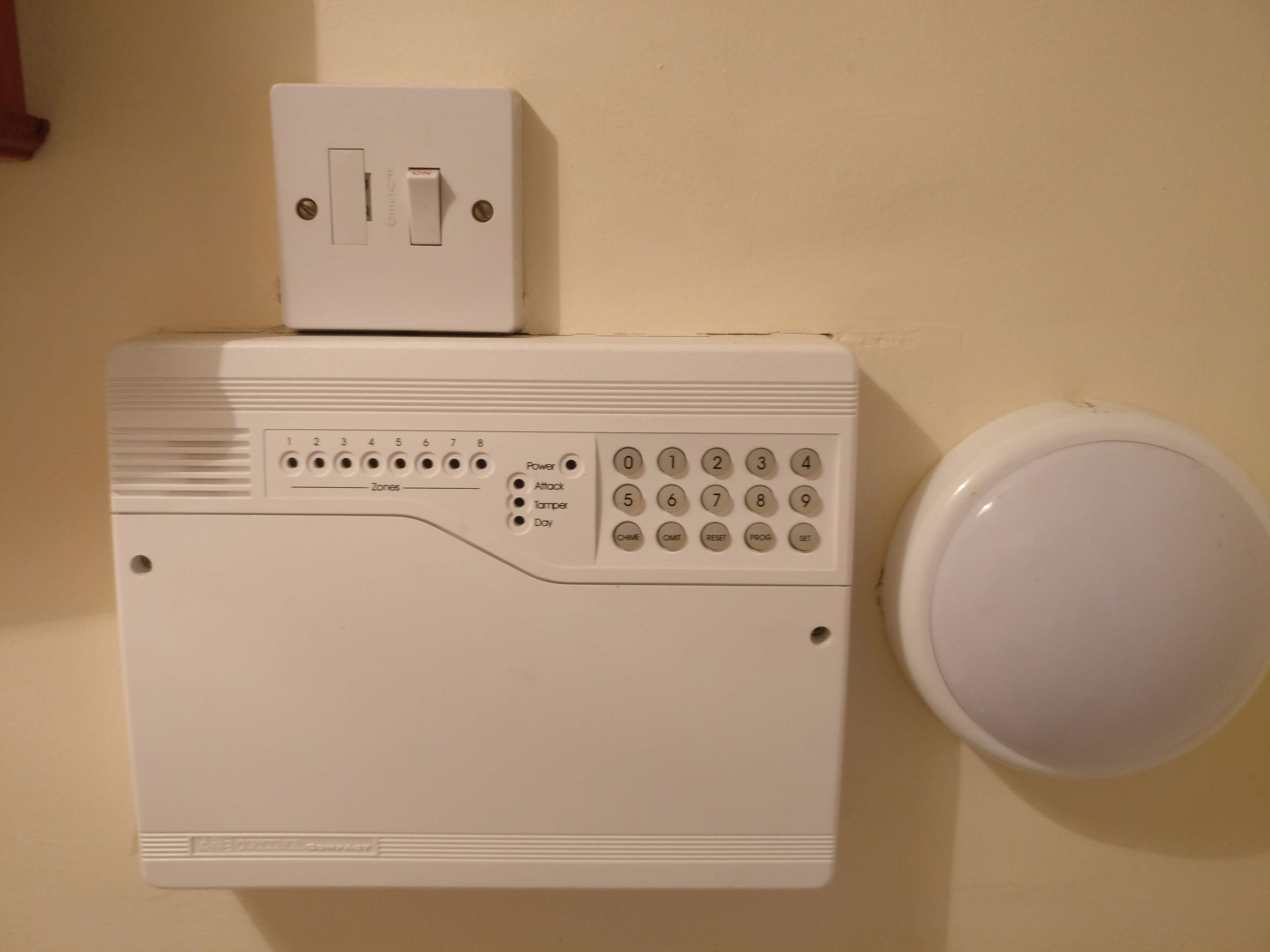 Accenta Alarm Box with isolation switch above and LED light to the side.