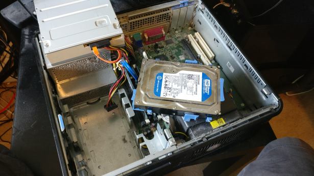 The hard drive in the Dell Optiplex 780 covered in dust
